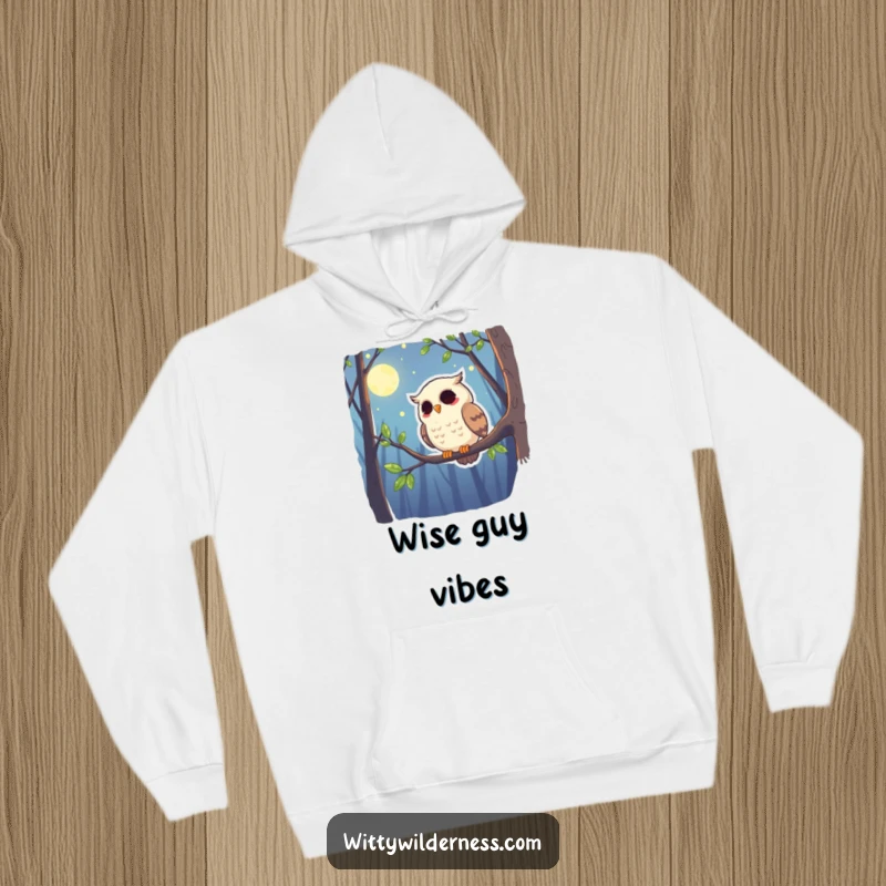 Funny hoodie featuring a giggling owl perched on a branch, scanning the moonlit forest with a warm, humorous expression.