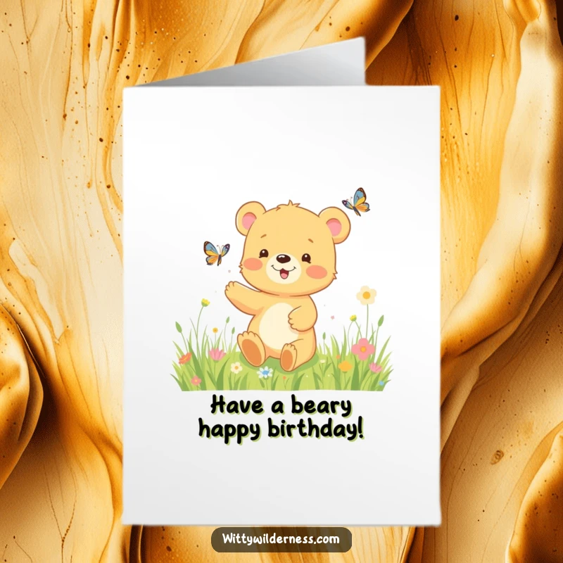 Funny Free Printable Birthday Card: Happy bear cub playfully chasing a butterfly in a sunny meadow, cute celebration art.